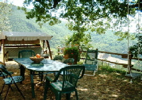 A shaded spot with a view at Janilee's Tuscan Villa, north of Florence, Italy.