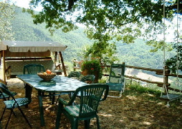 A shaded spot with a view at Janilee's Tuscan Villa, north of Florence, Italy.